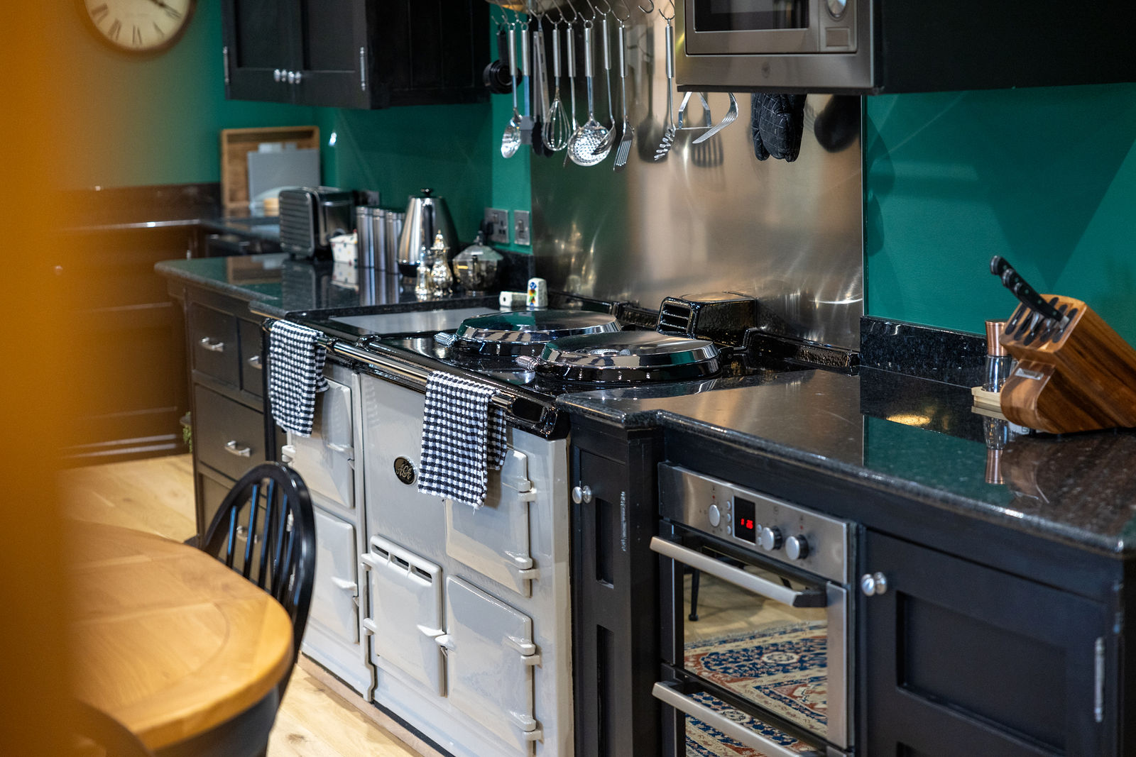 Contemporary teal kitchen with range cooker from a real estate video, by Inspire Drone Media, TA Full Capture Media