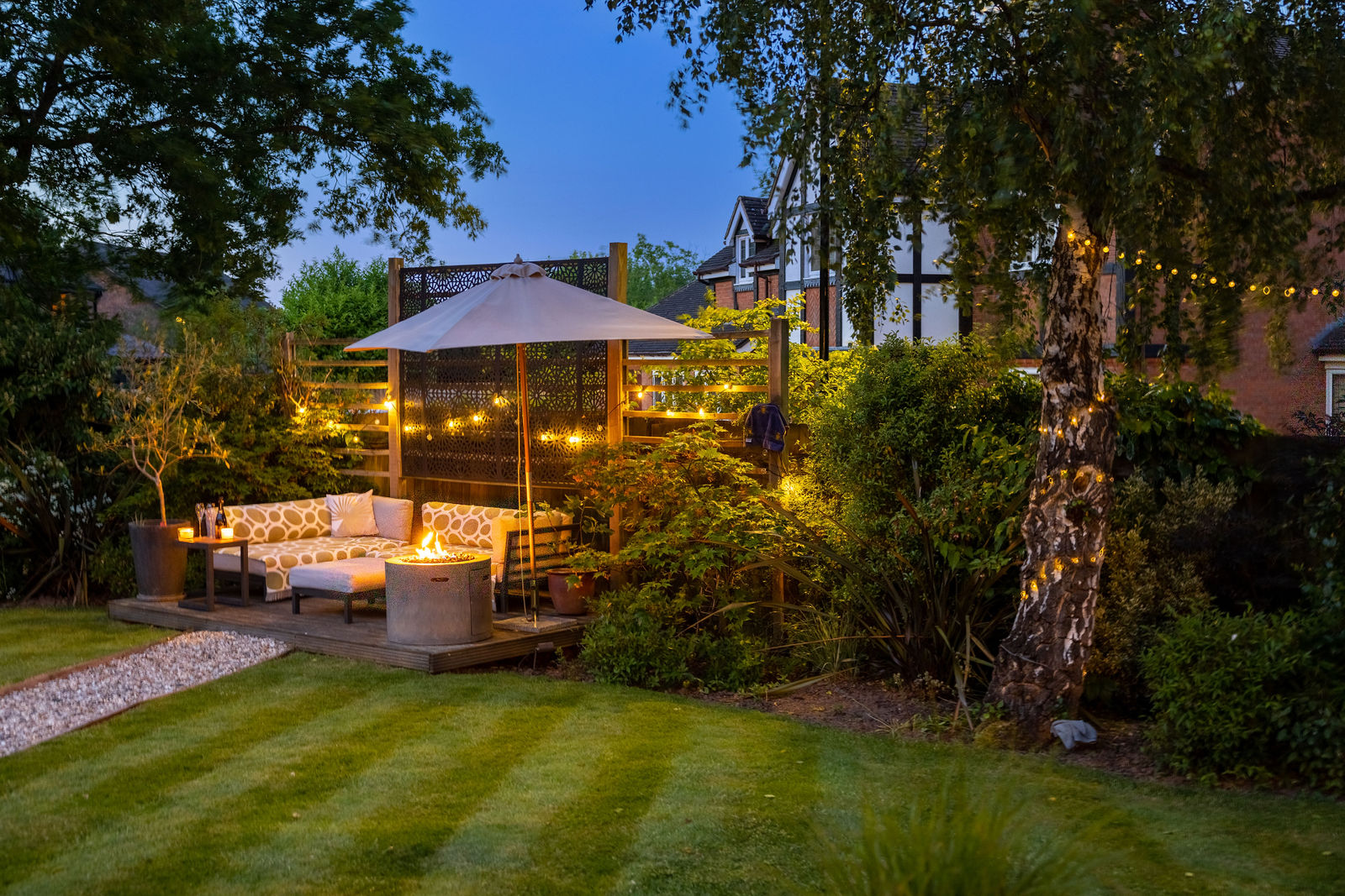 Evening view of a landscaped garden and garden room for a property video tour, by Inspire Drone Media, TA Full Capture Media