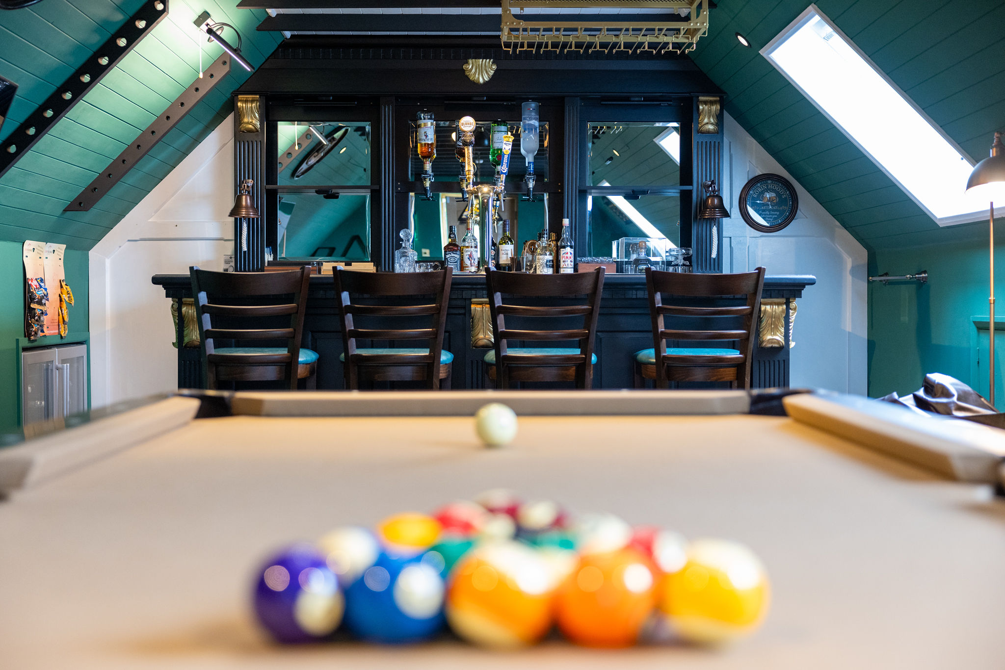 Entertainment room with bar and pool table