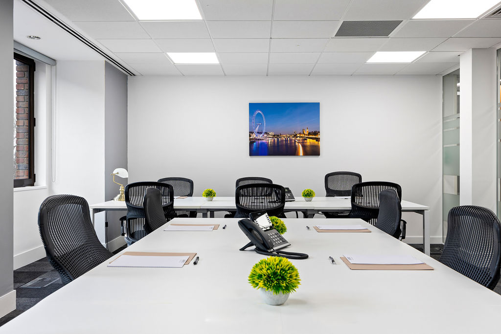 Professional conference room with modern furnishings and city views
