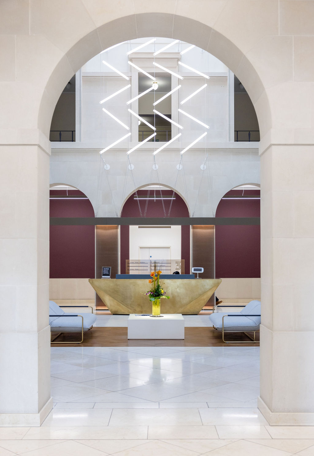 Architectural commercial building entrance through elegant archway at Brindley Place
