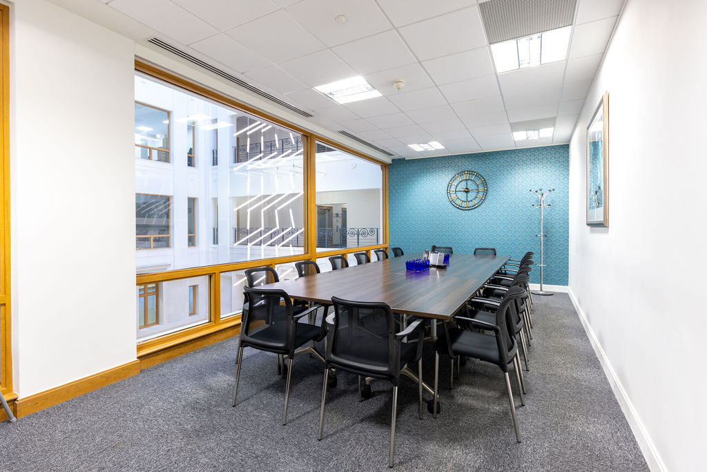 Large corporate conference room with blue accent wall at Brindley Place