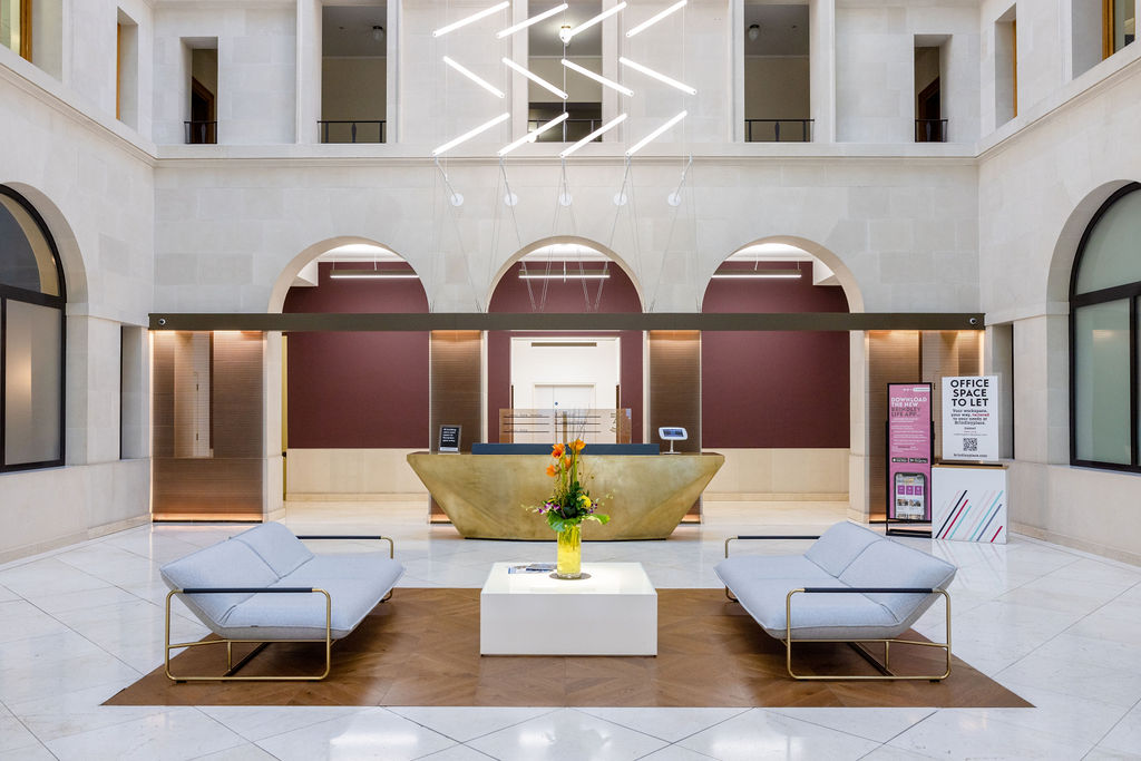 Modern commercial lobby with contemporary furnishings and artistic lighting at Brindley Place