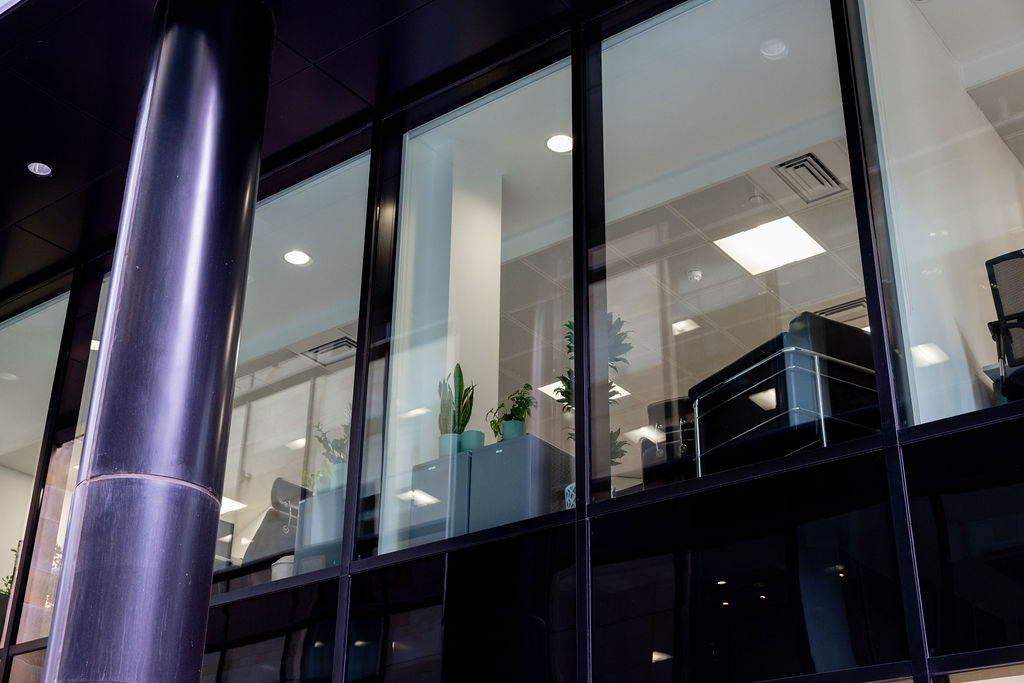 Commercial office building exterior detail showing contemporary design at twilight